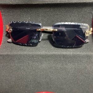 Cartier Men's Sunglasses with Black and Gold Detailing